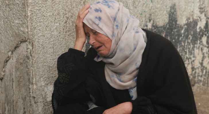 Elderly woman cries in Gaza Strip