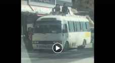 Update: School children ride on TOP of public transport bus, driver arrested