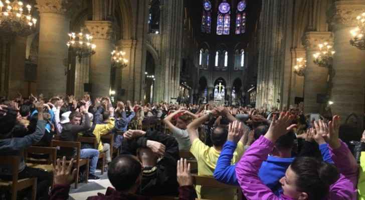 Police ask people inside Notre-Dame Cathedral to raise their hands after a man attacked a police officer nearby.