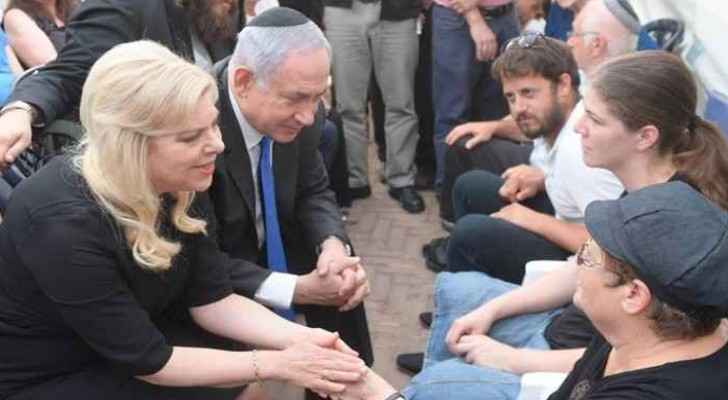 Netanyahu during his visit to the family of the murdered settlers yesterday.