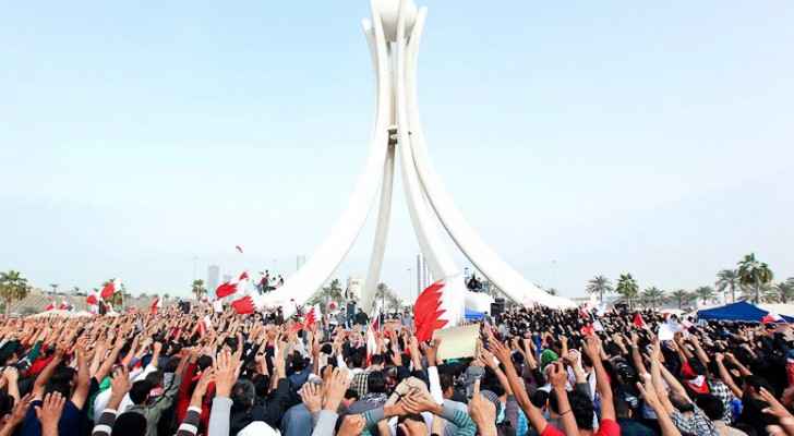 Protesters in Bahrain around the Pearl Roundabout  in February 2011. (Photo Credit:  BBC)