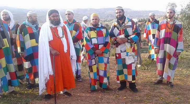 Members of Karakaria donning colorful robes. (Photo Credit: Echourouk)