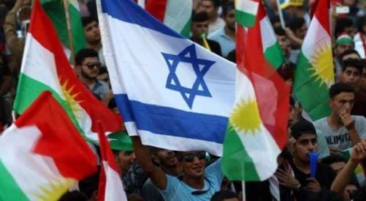 Iraqi Kurds fly an Israeli flag and Kurdish flags during an event to urge people to vote in the upcoming independence referendum. (AFP) 