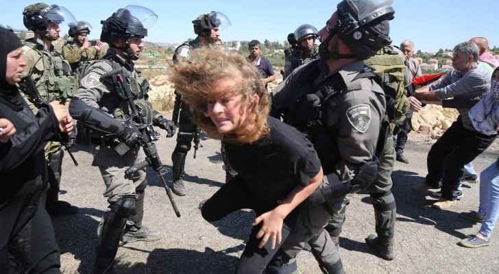 Old photo taken for Ahed Tamimi while trying to resist Israeli forces. (Archive)
