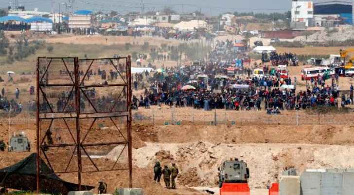 Palestinians demonstrating near the Gaza border fence
