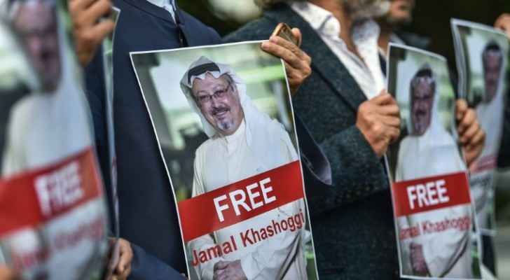 Activists carrying poster reading: Free Jamal Khashoggi (AFP / OZAN KOSE)
