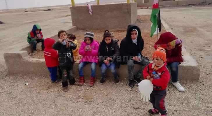 Jordanian professor walks with his small children from Tafila to Amman