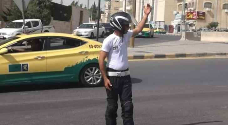Traffic police officers wear white T-shirts instead of usual uniform on accession to throne day