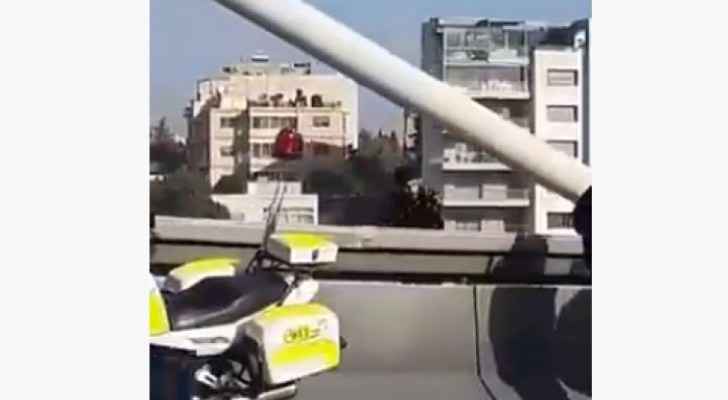 Young man attempts to commit suicide by jumping off Abdoun Bridge in Amman