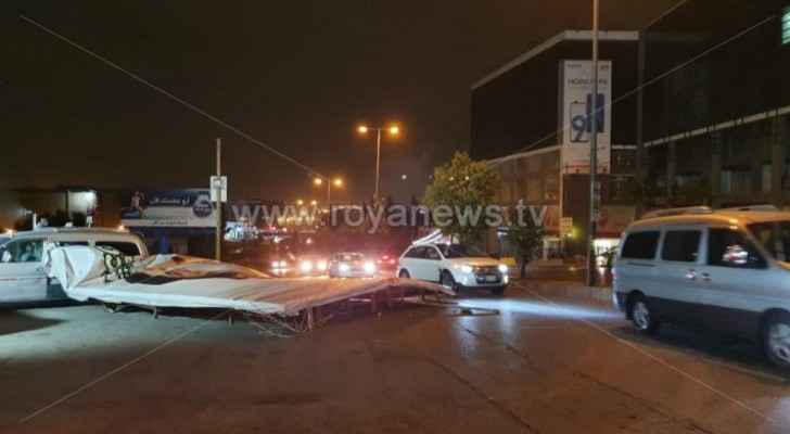 Large billboard falls on a street in Amman due to strong winds