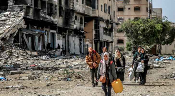 Palestinian family evacuating with belongings along a street in Gaza City. (March 27, 2024) (Photo: AFP) 