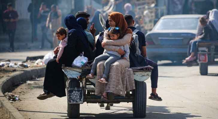 Displaced Palestinians leave Rafah on a cart, amid the ongoing “Israeli” incursion into the city. (May 7, 2024) (Photo by AFP)