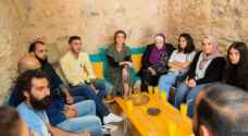 Queen Rania meets with youth during visit to Kawon Bookshop in Madaba