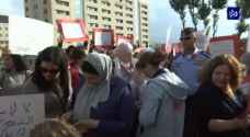 Members of Arab Women Organization organize protest against violence towards women