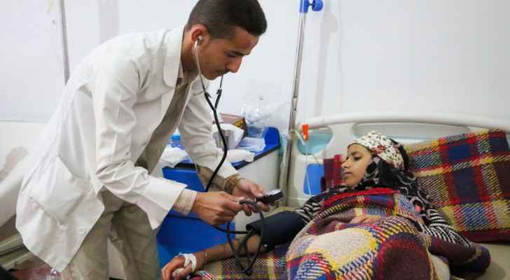 At the Al Sab’een Hospital in Sana'a, Yemen, a doctor checks on a girl suffering from cholera. (UNICEF) 