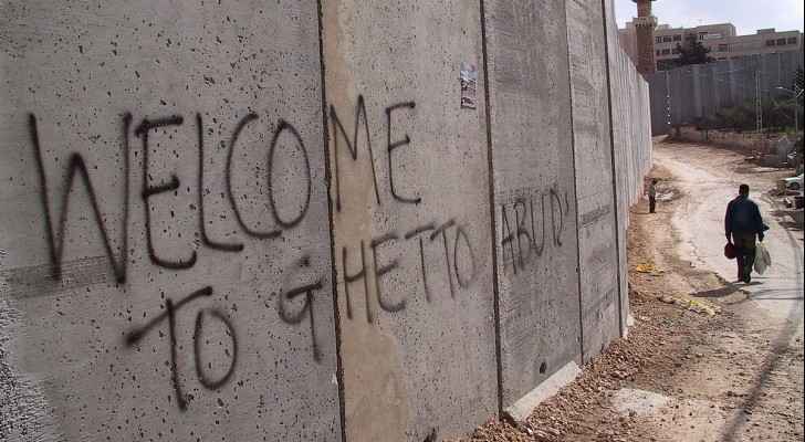 Israeli  separation wall at Abu Dis. (Wikimedia Commons) 