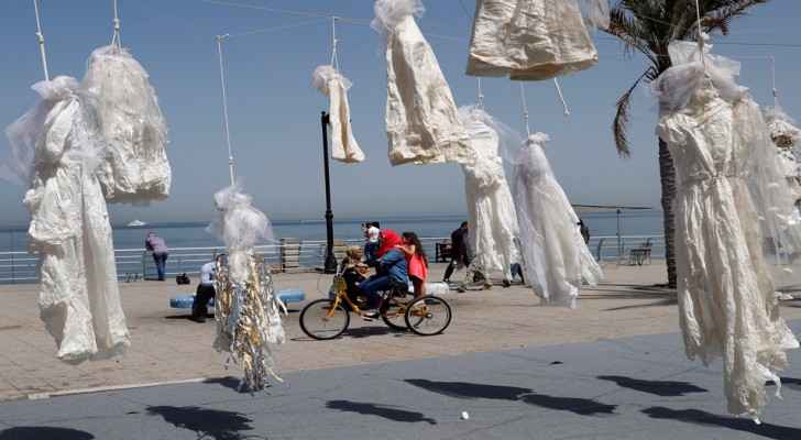 Art installation in Beirut protesting the law using wedding dresses. (Photo Credit: AP/Hussein Malla)