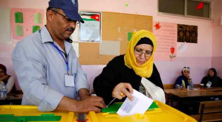A Jordanian woman casts her ballot at a polling station for municipal elections in Amman.