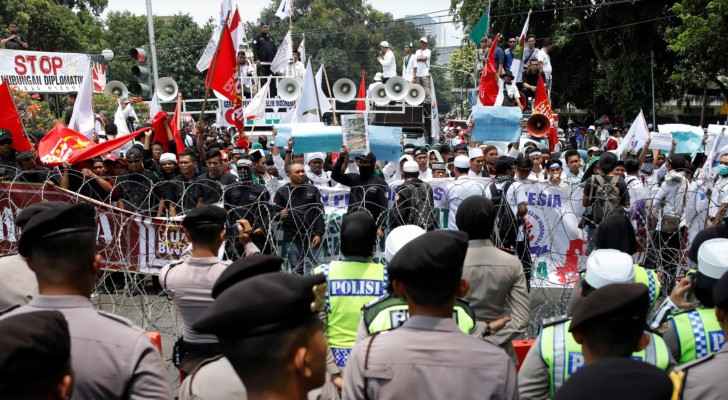 Protestors gathered in Jakarta calling for suspension of ties with Myanmar. (Photo Credit: Reuters)