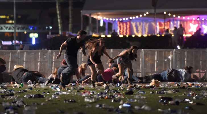 People run from the Route 91 Harvest country music festival in Las Vegas. (Photo by David Becker/Getty Images)