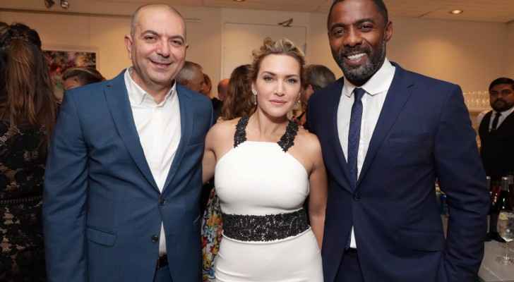 Hany Abu-Assad with his film's cast: Kate Winslet and Idris Elba.