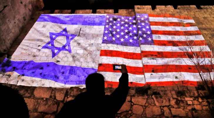 US-Israeli flags illuminated on Jerusalem walls ahead of Trump's deicision.