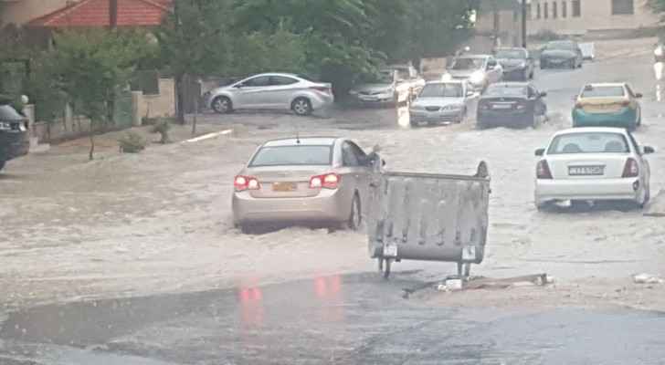 Heavy rain floods the roads in Amman. (Roya)