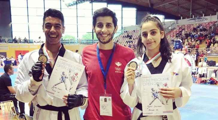 Taekwondo champions Natalie Hamidi and Fahed Ammar with Coach Laith Izzat