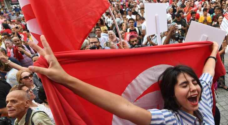 Women at a demonstration to mark Tunisia's Women's Day and to demand equal inheritance rights between. (The National)