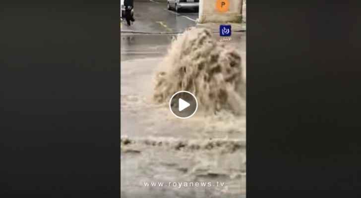 Video: manhole cover explodes with floodwater in Downtown Amman