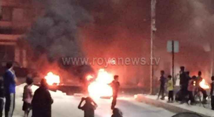 Rioters block road in Irbid with burning tires