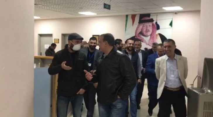 Mohammad Al Hyari accompanied by the Health Minister as he leaves quarantine 
