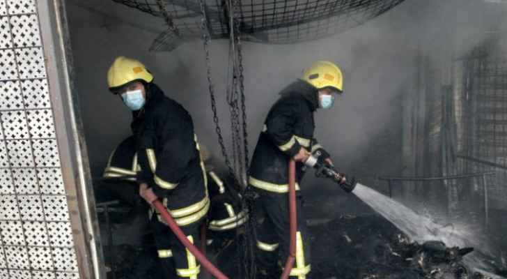 Firefighters extinguish fire in second-hand clothing stores in Zarqa