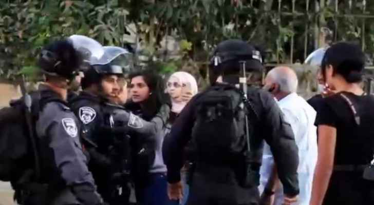 'Raise your head high' says a bystander to journalist Halawani as IOF arrest her in Sheikh Jarrah