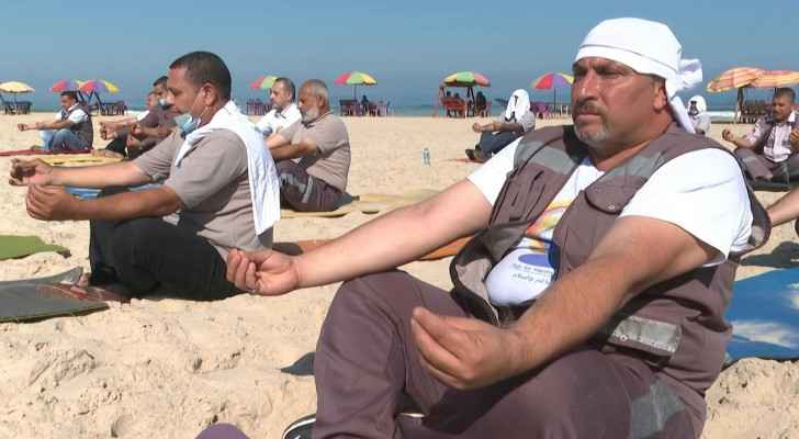 Palestinian paramedics mark International Yoga Day on Gaza beach