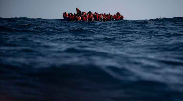 Migrants wait to be assisted by Open Arms aid workers  in the Mediterranean sea after fleeing Libya - Picture from AP