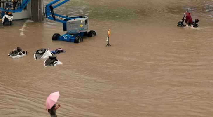 12 killed in flooded subway as torrential rains hit central China