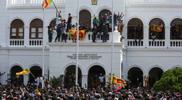 Protesters storm Sri Lanka PM's office after President flees abroad