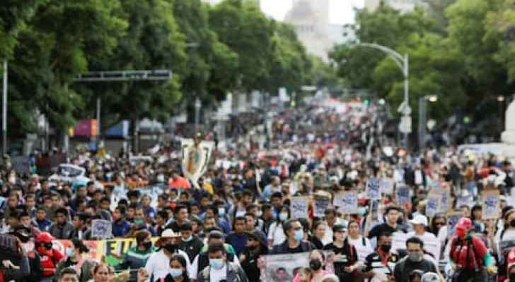 Thousands march to demand justice for Mexico's missing students