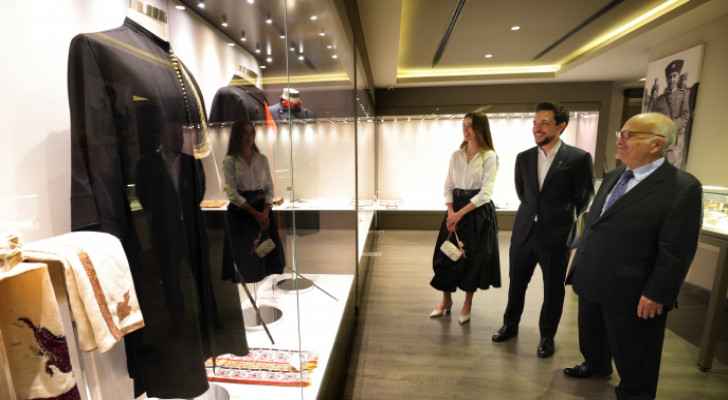 Prince El Hassan bin Talal, Prince Hussein and his fiancée look at collections of Hashemite family