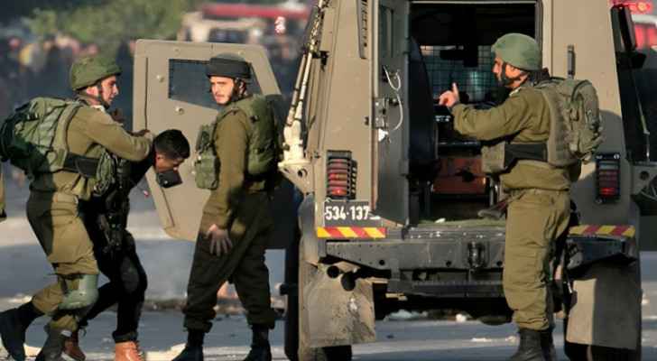 Israeli Occupation Forces during their raid on neighborhoods in the West Bank