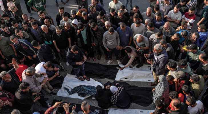Palestinians mourn over the bodies of victims of “Israeli” bombardment in Maghazi in central Gaza. (April 16, 2024) (Photo: AFP) 