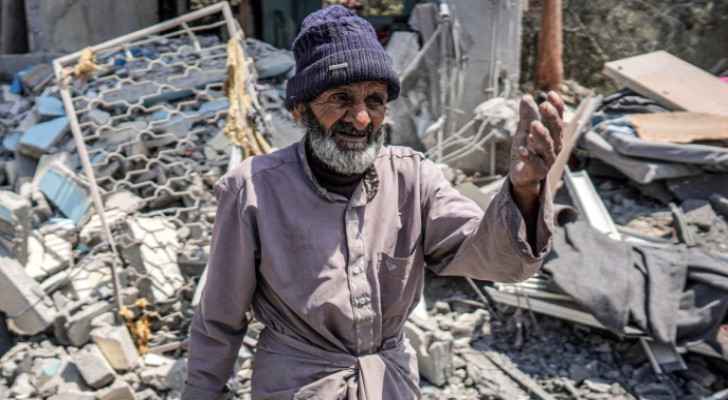 Man's reaction walking amid rubble in Gaza's Maghazi refugee camp