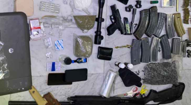Seized weapons, drugs from Anti-Narcotics Department raids. (Photo: Public Security Department) 