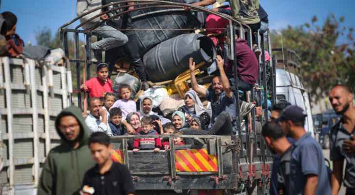 Palestinian in Rafah carrying their belongings and heading to safer areas in southern Gaza Strip.