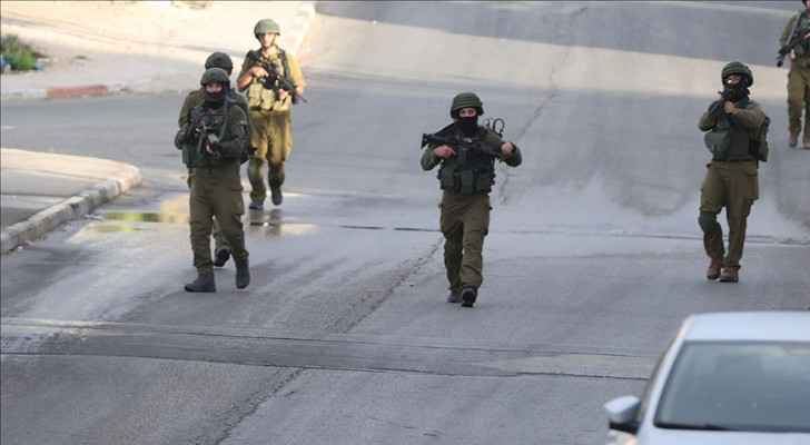"Israeli" forces carrying out raids in the West Bank. (File photo) 