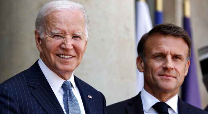 US President Joe Biden smiles as he is welcomed by France's President Emmanuel Macron ahead of a bilateral meeting at the Presidential Elysee Palace. 