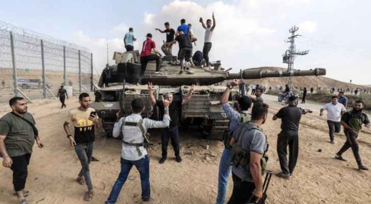 Palestinian children dancing on top of Israeli Occupation tanks.