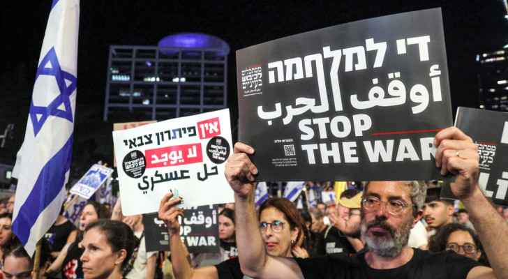 “Israeli” protesters gather during an anti-government demonstration outside the defense ministry. (Tel Aviv) (June 15, 2024) (Photo: AFP) 