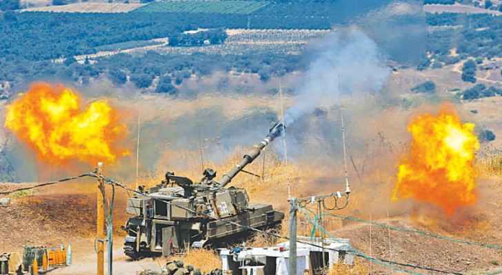 “Israeli” self-propelled howitzers fire towards Lebanon in an exchange of fire with Lebanese group Hezbollah. (File photo: AFP) 